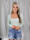Bodysuit features a square neck line, waffle material, sage color, fitted fit, snap bottom closure and runs true to size! 