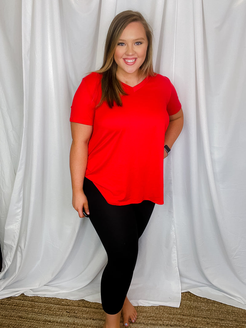 Top features a solid base color, butter fabric soft material, short sleeves, round neck line, and runs true to size!-black