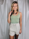 Bodysuit features a simple and flattering scoop neck with a soft, stretchy material.-sage