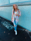 Blazer features an ivory base, vibrant colors, floral print design, 3/4 sleeve, open front detail and runs true to size! 
