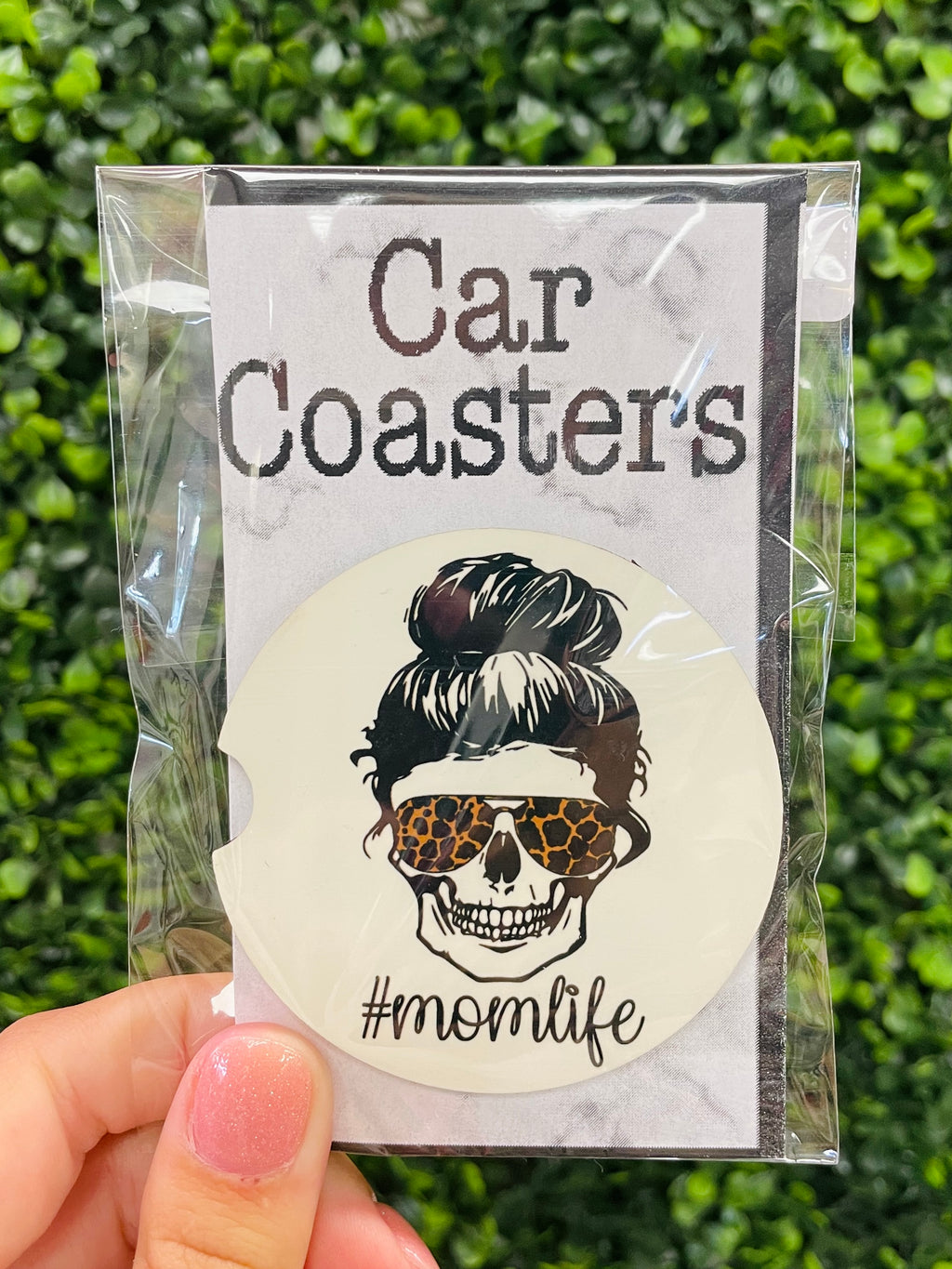 Show off your #MomLife pride with this hilarious car coaster! Featuring a skeleton and messy bun design, it's perfect for any mom on the go. Practical and fun, it makes a great gift for any weary momma needing surviving and thriving . #MomLife never looked better.