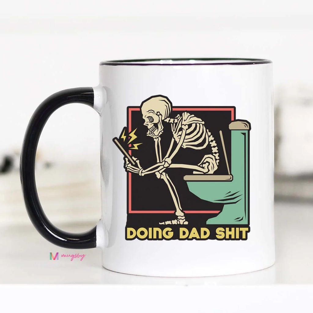 For the dad who does it all, give the gift of laughter with this Doing Dad Shit Mug! This cheeky ceramic mug features a skeleton on the ol' porcelain throne, reminding you to laugh at the typical dad stuff - no job too gross! Perfect for any funny gift-giving occasion. Get your "shit" together and preorder one today!  Ceramic mug 11 oz.  Double sided print Top rack dishwasher safe.  Microwave safe 