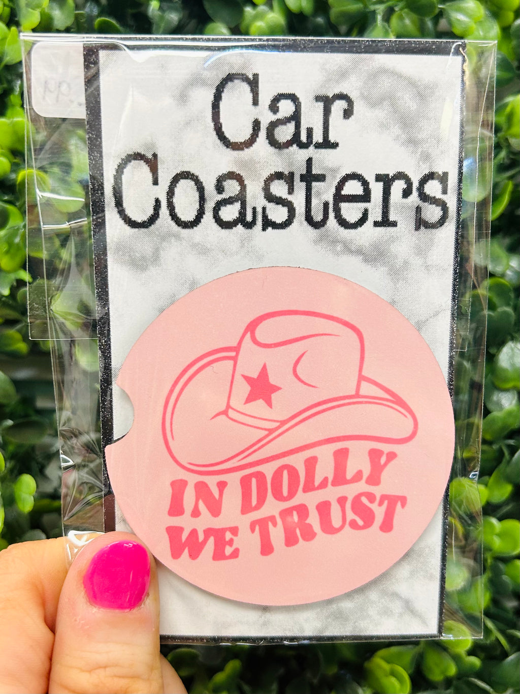 This quirky car coaster is a must-have for a Dolly Parton fan! Featuring the phrase "In Dolly We Trust", it's the perfect gift for your favorite Dolly devotee. Trust us, they'll be 'dollying' up their dashboard in no time!