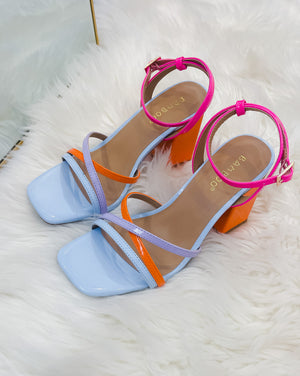 Put a spring in your step with our Forever Darling Heels! These fashionable shoes come in a dynamic mix of pink and blue with complementary orange heel detailing, to add a cheerful touch to any outfit. With an adjustable ankle strap, they'll always stay comfortably in place no matter how much you shake your stuff!