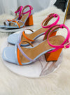 Put a spring in your step with our Forever Darling Heels! These fashionable shoes come in a dynamic mix of pink and blue with complementary orange heel detailing, to add a cheerful touch to any outfit. With an adjustable ankle strap, they'll always stay comfortably in place no matter how much you shake your stuff!