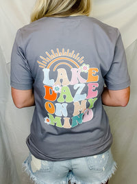 Stay poppin' with the Lake Daze On My Mind Graphic Tee! This summery unisex tee features a "lake daze on my mind" bubble font, sweet flower detailing and bold pastel colors that'll make your wardrobe come alive! Perfect for your next lake outing! Let's get this lake daze party started!