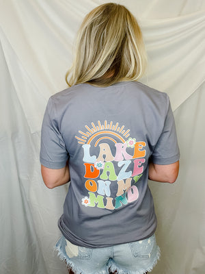 Stay poppin' with the Lake Daze On My Mind Graphic Tee! This summery unisex tee features a "lake daze on my mind" bubble font, sweet flower detailing and bold pastel colors that'll make your wardrobe come alive! Perfect for your next lake outing! Let's get this lake daze party started!
