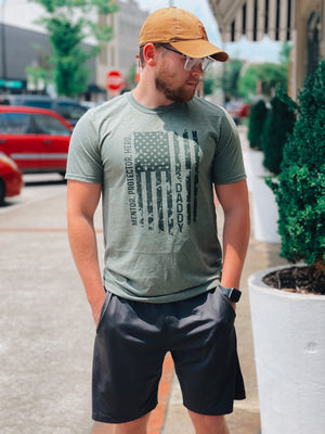 Give the strongest man in your life the perfect Father's Day gift with this Graphic Tee! Featuring bold words that aptly describe him (hero, mentor, protector, Daddy!), this tee is sure to bring a smile to his face. Perfect for days out and special occasions alike!     2XL will be printed on an ash grey instead of a military green 🖤