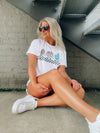Catch the game day vibe with this vintage football tee! Show off your love of the sport with this one-of-a-kind, short-sleeved graphic tee featuring football characters and a cool, retro vibe. Unisex fit and fun graphics make this tee the perfect way to strut your stuff in style! Go team go!