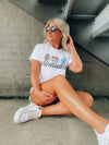 Catch the game day vibe with this vintage football tee! Show off your love of the sport with this one-of-a-kind, short-sleeved graphic tee featuring football characters and a cool, retro vibe. Unisex fit and fun graphics make this tee the perfect way to strut your stuff in style! Go team go!