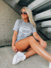 Score a touchdown in style with this Football Gameday Graphic Tee! Whether you're tailgating or watching from home, you'll be ready to cheer on your favorite team with this comfy, unisex design. This one's a surefire winner! Go long! ;)-GREY