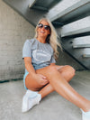 Score a touchdown in style with this Football Gameday Graphic Tee! Whether you're tailgating or watching from home, you'll be ready to cheer on your favorite team with this comfy, unisex design. This one's a surefire winner! Go long! ;)-GREY