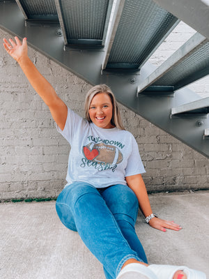 Get ready for touchdown season with this awesome unisex graphic tee! Show your spirit with this classic game day look featuring a football graphic and short sleeves – perfect for any football fanatics out there. TOUCHDOWN!!! 🏈