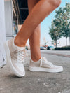 Elevate your style effortlessly with these Stride On Sneakers! They come with luxe gold sequin detailing, comfy memory foam, and traditional lace-up styling, so you can look great while feeling even better. Step out in style with these versatile sneakers!