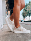 Elevate your style effortlessly with these Stride On Sneakers! They come with luxe gold sequin detailing, comfy memory foam, and traditional lace-up styling, so you can look great while feeling even better. Step out in style with these versatile sneakers!