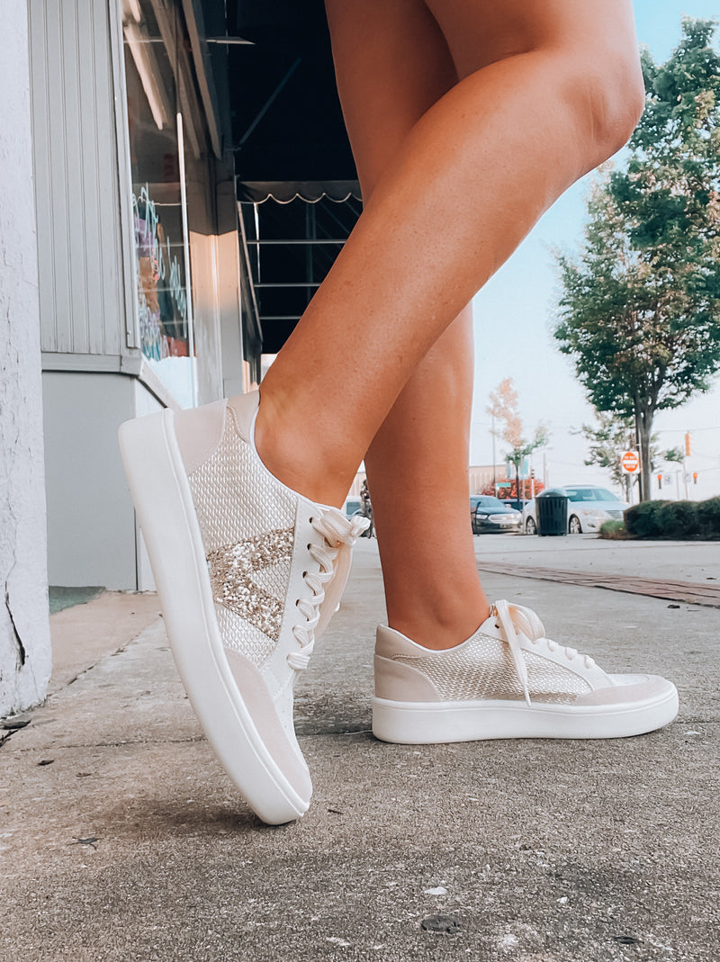Elevate your style effortlessly with these Stride On Sneakers! They come with luxe gold sequin detailing, comfy memory foam, and traditional lace-up styling, so you can look great while feeling even better. Step out in style with these versatile sneakers!