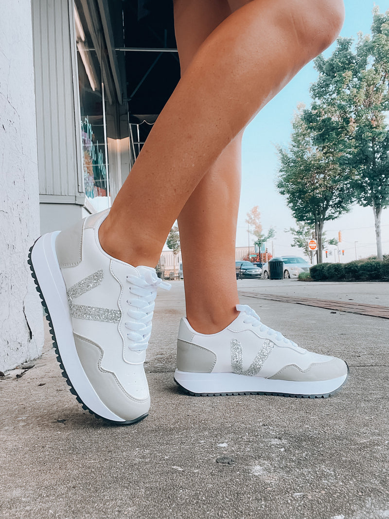 Stay ahead of the trend with our Sweet Wish Sneakers! These stylish sneakers feature lace up memory foam, and come in a fashionable white and silver color with an extra splash of glitter detailing. Ready for a spin? Strut in ultimate style and comfort!