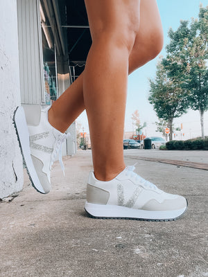 Stay ahead of the trend with our Sweet Wish Sneakers! These stylish sneakers feature lace up memory foam, and come in a fashionable white and silver color with an extra splash of glitter detailing. Ready for a spin? Strut in ultimate style and comfort!