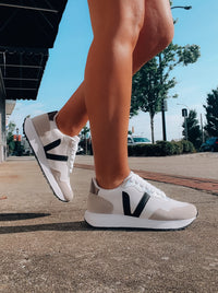 Introducing the Savor The Sweetness Sneakers! Step out in comfort and style in these black and white kicks, with memory foam insoles to cradle your feet in all the right places. Plus, lacing up will be a breeze - and even more fun than usual! Slide into sweet comfort and lasting style.