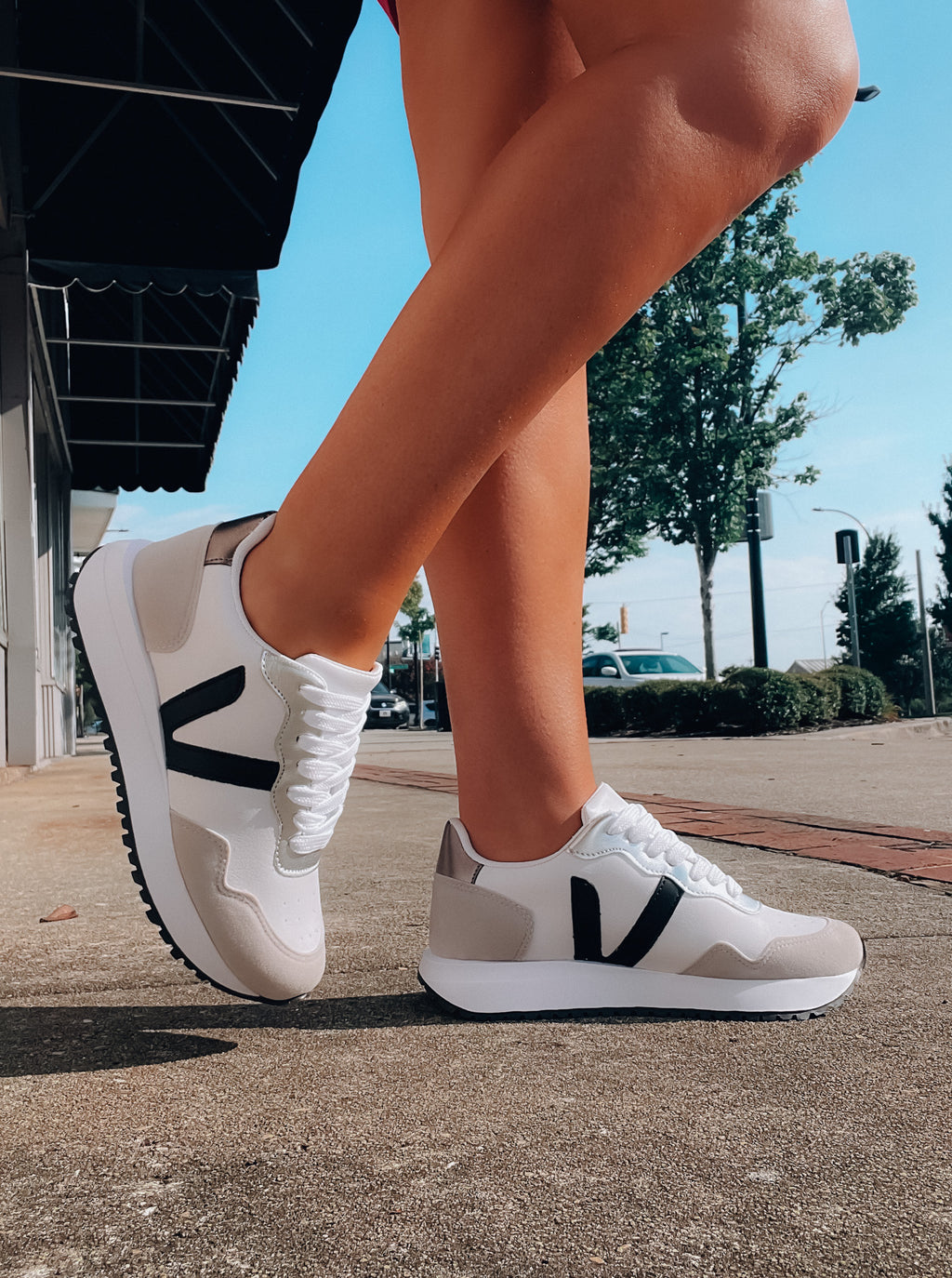 Introducing the Savor The Sweetness Sneakers! Step out in comfort and style in these black and white kicks, with memory foam insoles to cradle your feet in all the right places. Plus, lacing up will be a breeze - and even more fun than usual! Slide into sweet comfort and lasting style.