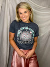 Look fly and stay groovy in this "Meet Me At Midnight" graphic tee. Featuring a sassy disco ball, eye-catching pink and teal hues, and a classic round neckline, you'll be the life of the party. Time to boogie!  MODEL INFO:  Aubree has on a Large and Carrington a small.   ** These are printed on our vintage washed tees and don't run as oversized as our bella and gildan. If you want to wear with leggings- you may want to size up. We would still say they are pretty TTS just as loose as a fit. 