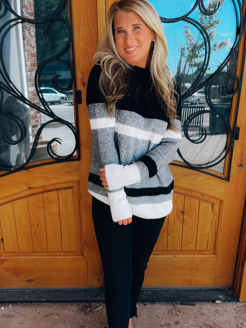 Sweater features a color block striped detail, long sleeve, crew neck line, comfy material and runs true to size! -brown