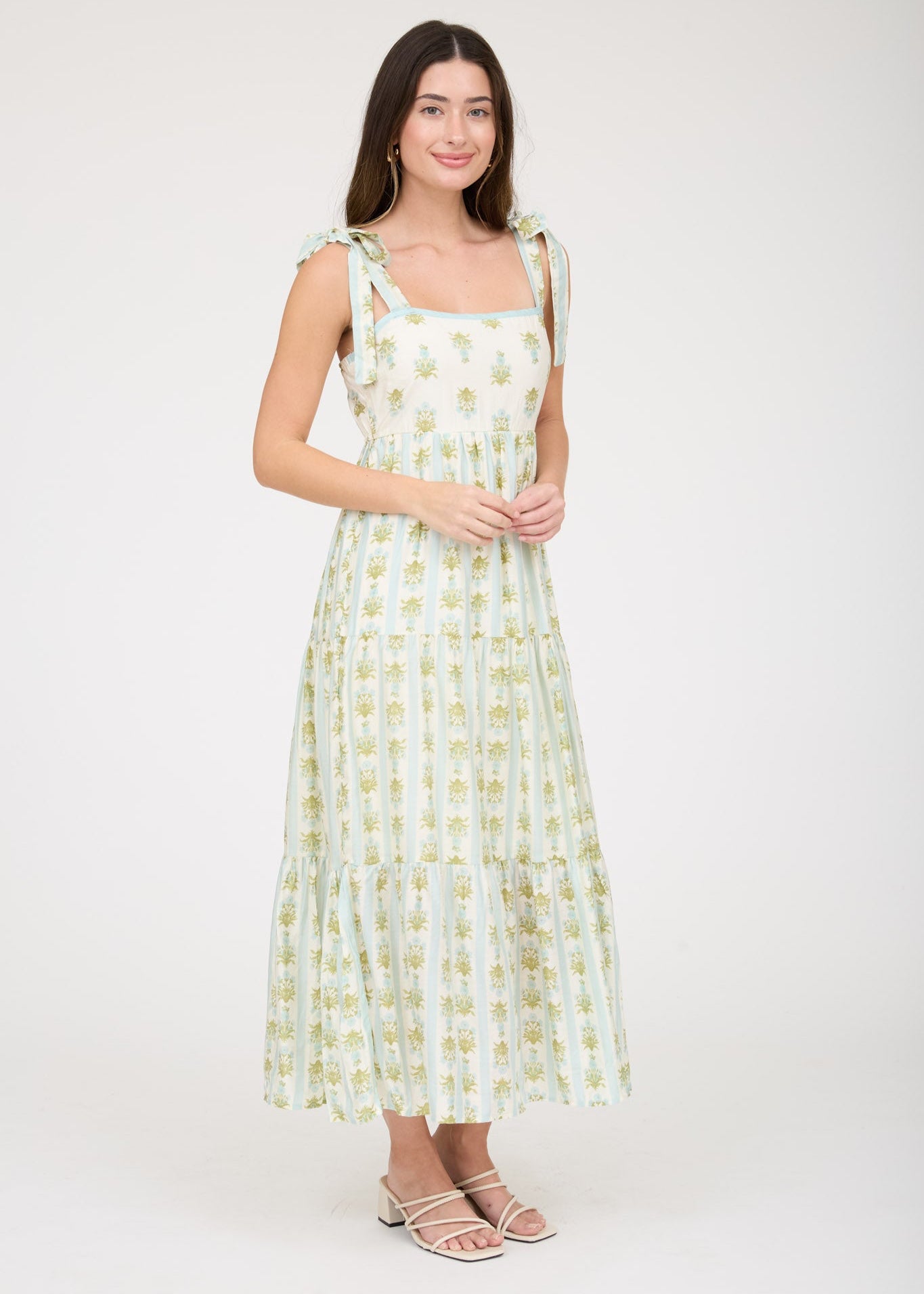 Woman wearing a floral dress on a white background