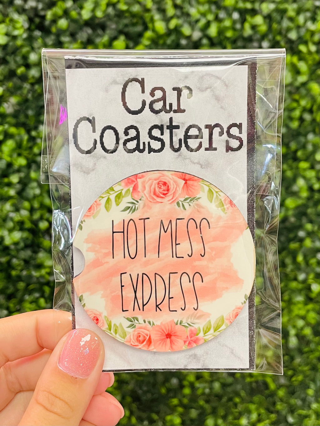 Don't let your car be a hot mess! Get the Hot Mess Express Coaster to keep your ride - and your life - looking fresh. This coaster is pink and floral, making sure you get an extra burst of personality every time you drive. It's the perfect gift for the car lover in your life - and their interior!