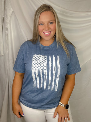 This patriotic tee will make any heart swell with pride! It features a distressed flag design with a bold, unisex fit and a classic round neckline. Honor your country in style with this must-have tee!-blue