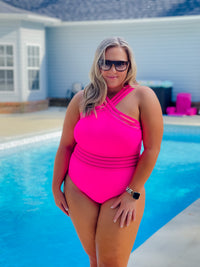 Show off your tropical-inspired style with the Tropical Tides One Piece Swimsuit! Featuring a hot pink hue, mesh detailing, and a criss cross neck line–this stunning one piece will make a splash! With full coverage bottoms for a flattering fit and extra support, you'll be the star of the beach! Get ready to feel confident and embrace those waves!