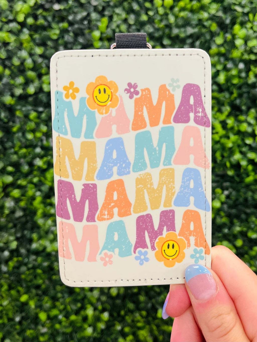 Retro is back and stronger than ever with this funky Mama Card Holder Keychain! Featuring bold flower details and a sleek design, it's the perfect way to keep your cards safe and sound on-the-go. So stay organized and stylish with this one-of-a-kind keychain!
