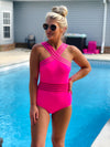 Show off your tropical-inspired style with the Tropical Tides One Piece Swimsuit! Featuring a hot pink hue, mesh detailing, and a criss cross neck line–this stunning one piece will make a splash! With full coverage bottoms for a flattering fit and extra support, you'll be the star of the beach! Get ready to feel confident and embrace those waves!