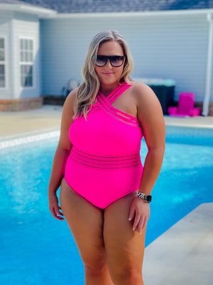 Show off your tropical-inspired style with the Tropical Tides One Piece Swimsuit! Featuring a hot pink hue, mesh detailing, and a criss cross neck line–this stunning one piece will make a splash! With full coverage bottoms for a flattering fit and extra support, you'll be the star of the beach! Get ready to feel confident and embrace those waves!