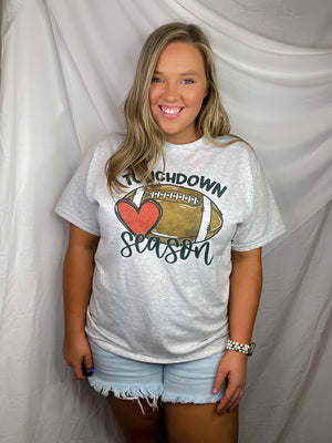 Get ready for touchdown season with this awesome unisex graphic tee! Show your spirit with this classic game day look featuring a football graphic and short sleeves – perfect for any football fanatics out there. TOUCHDOWN!!! 🏈
