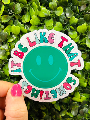 Show off your sense of humor with this "It Be Like That Sometimes" smiley face sticker! Express life's unexpected twists and turns with this funny, semi-ironic design that's sure to get a chuckle. Great for laptops, notebooks, water bottles, and more!