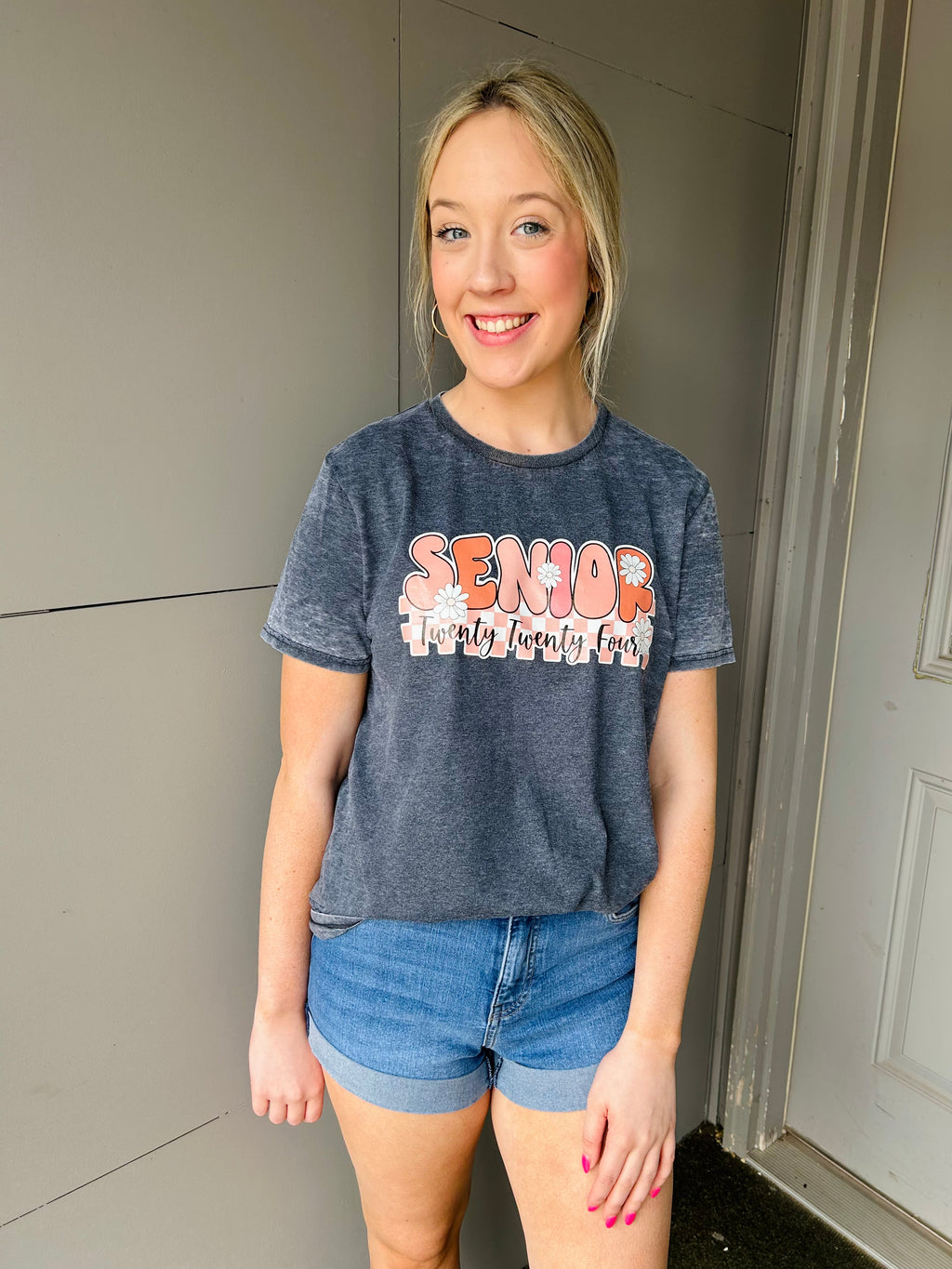 Lookin' for that perfect gift for the seniors graduating in '24? This Retro Senior '24 Graphic Tee is just that – the perfect mix of retro and fresh! With its cute bubble font, short sleeves and unisex fit, they'll be stylin' from the day they accept their diploma! Congrats, seniors!