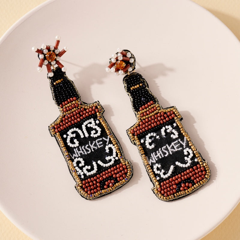 Earrings feature a light weight feel, beaded detailing and runs true to size!-WHISKEY