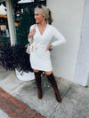 Dress features a solid base color, soft knit material, long sleeves, V-neck line, tie waist band, knee length and runs true to size with a true fitted shape!-ivory