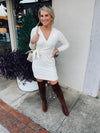 Dress features a solid base color, soft knit material, long sleeves, V-neck line, tie waist band, knee length and runs true to size with a true fitted shape!-ivory