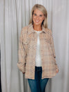 Shacket features a tan/ brown plaid print, long sleeves, open front detailing, button closure and runs true to size! 