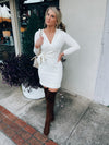 Dress features a solid base color, soft knit material, long sleeves, V-neck line, tie waist band, knee length and runs true to size with a true fitted shape!-ivory