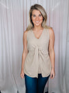 This versatile top is a perfect statement piece for all seasons. Crafted with an elegant taupe color, the Subtly Sweet Top features a sleeveless design, a round neckline, layered detailing and a front twist knot detail. Its neutral color complements any outfit and is sure to add a stylish touch to your wardrobe.  Top features a neutral beige color, sleeveless detail, round neck line, twist knot detail, layered look and runs true to size! 