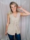 This versatile top is a perfect statement piece for all seasons. Crafted with an elegant taupe color, the Subtly Sweet Top features a sleeveless design, a round neckline, layered detailing and a front twist knot detail. Its neutral color complements any outfit and is sure to add a stylish touch to your wardrobe.  Top features a neutral beige color, sleeveless detail, round neck line, twist knot detail, layered look and runs true to size! 