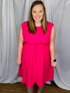 Dress features a solid base color, sleeveless detail, adjustable tie waist, front pocket detail and runs true to size! -pink