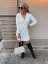 Dress features a solid base color, soft knit material, long sleeves, V-neck line, tie waist band, knee length and runs true to size with a true fitted shape!-ivory