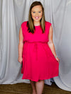 Dress features a solid base color, sleeveless detail, adjustable tie waist, front pocket detail and runs true to size! -pink