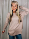 Top features a deep taupe color, dreamy soft material, long sleeves, boat neck line, hi-low hem and runs true to size! 