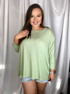 Top features a dolman sleeve, super soft ribbed material with a cuff sleeve and an oversized fit. -SAGE