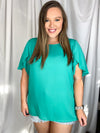 This teal top is designed to have a lose fit with a light, airy sleeve perfect for those breezy spring days ahead, and runs true to size! 