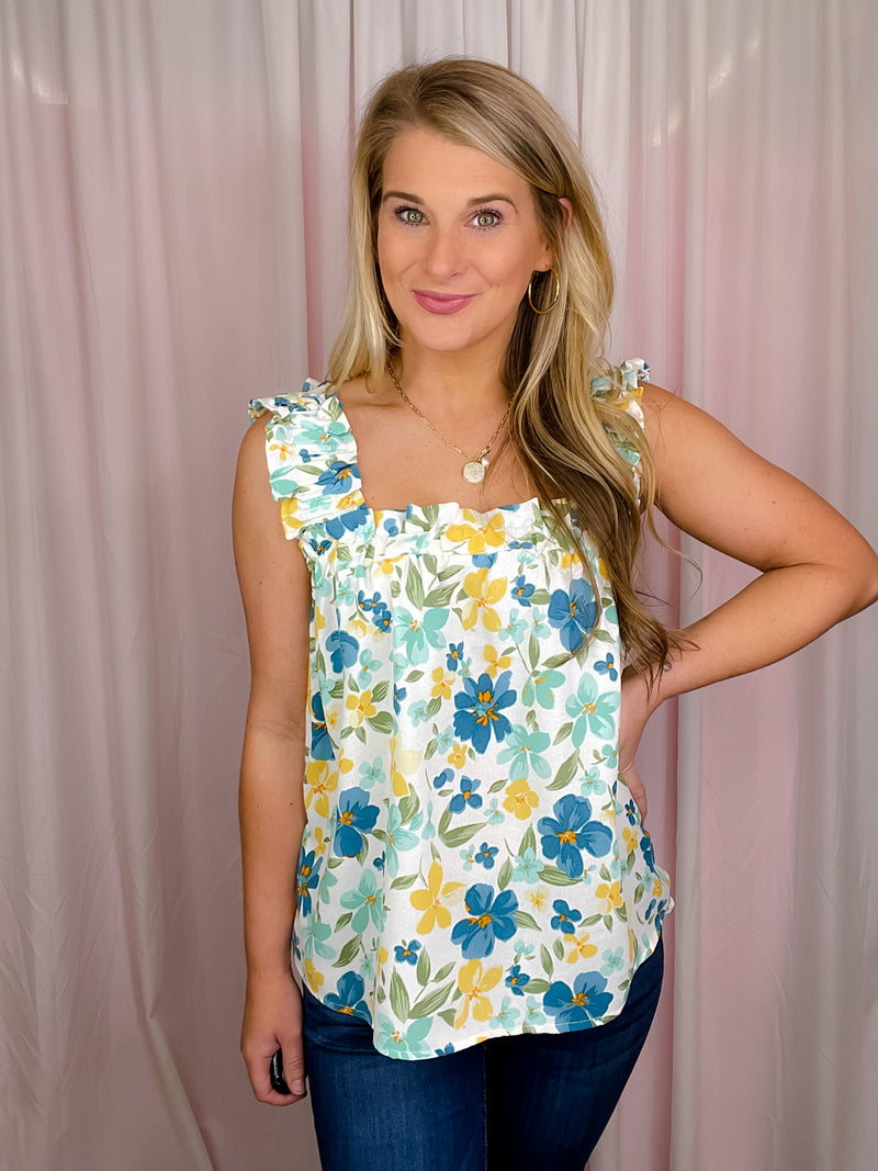 This Blooming Head To Toe Top is perfect for the summer months, boasting a bright and beautiful floral print atop a lightweight and airy fabric. This sleeveless top features a stylish ruffle hem and a flattering square neckline for a trend-right and fun look. The perfect mix of comfortable and stylish, the lightweight material of this top will keep you cool and fresh all day.-mint